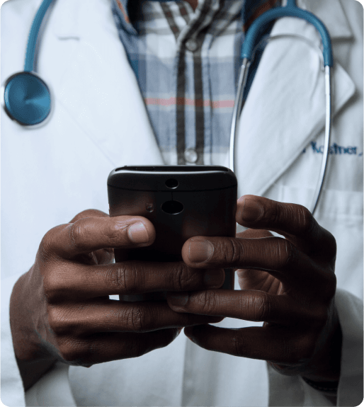Healthcare professional using smartphone with stethoscope